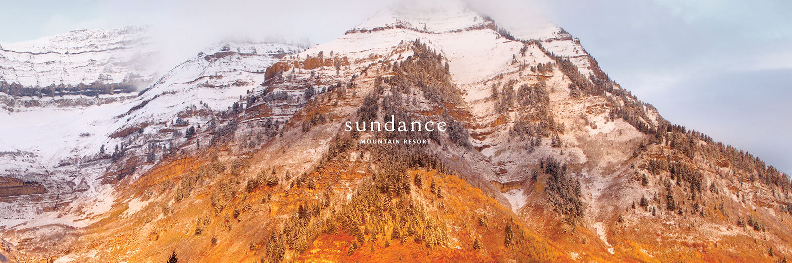 Snow-capped mountain range image with Sundance Resort logo
