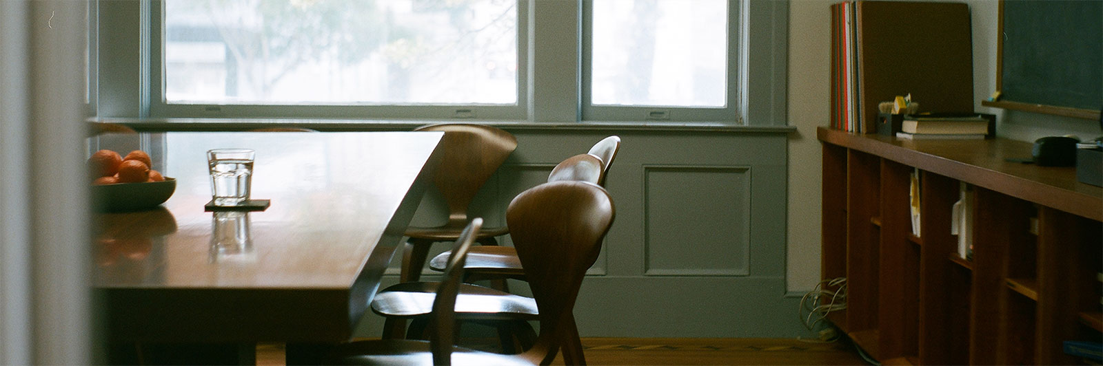 Partial view of conference room table with chairs