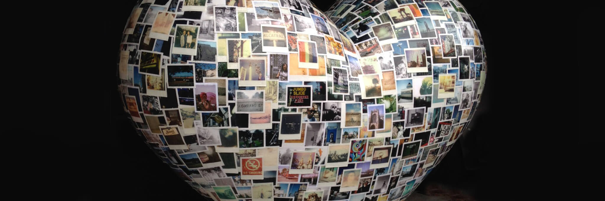 Cropped image of polaroid-covered heart sculpture