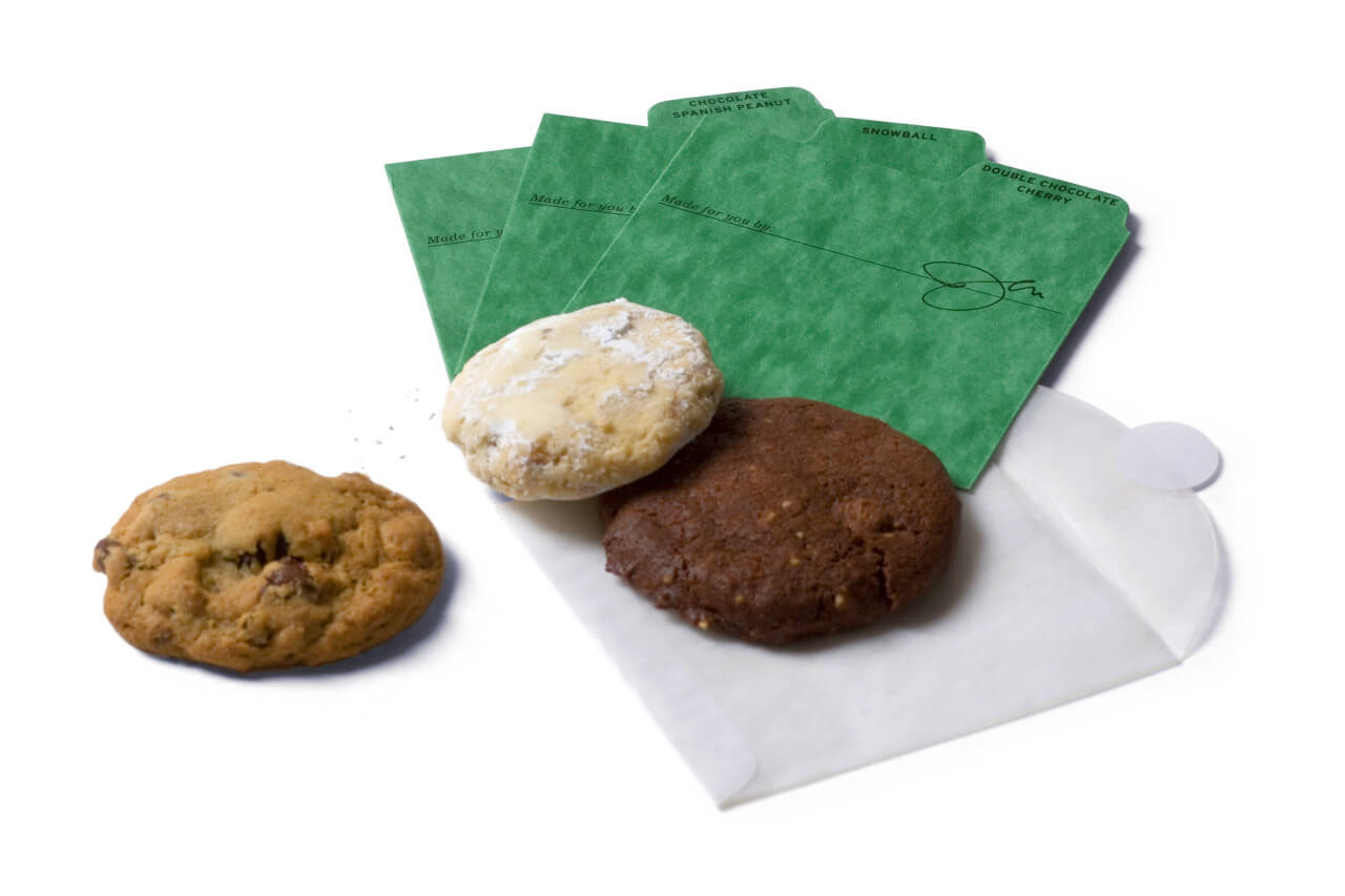 3 cookies with green separators and 1 glassine cookie envelope