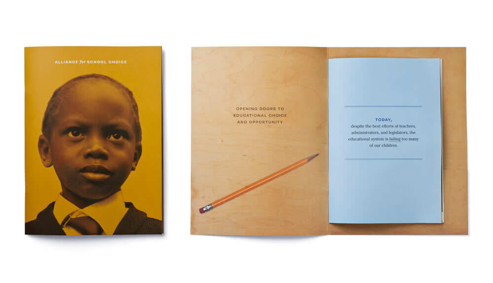 Deep yellow booklet cover with face of child and open interior spread showing blue sheet