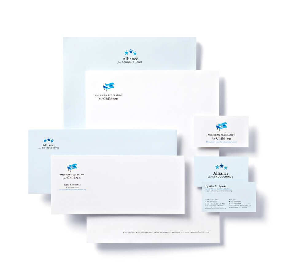 White and light blue letterhead, envelopes, and business card stationery sets