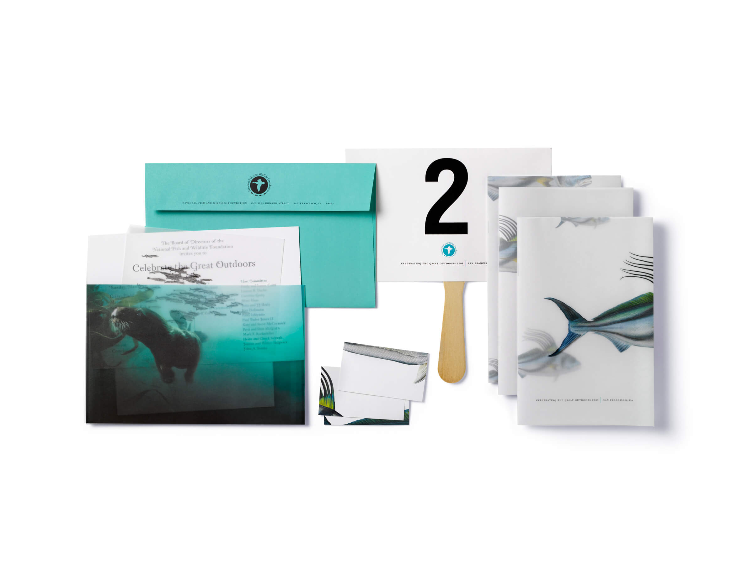 Sea creature themed program books, cards, invitation with teal envelope, and #2 paddle