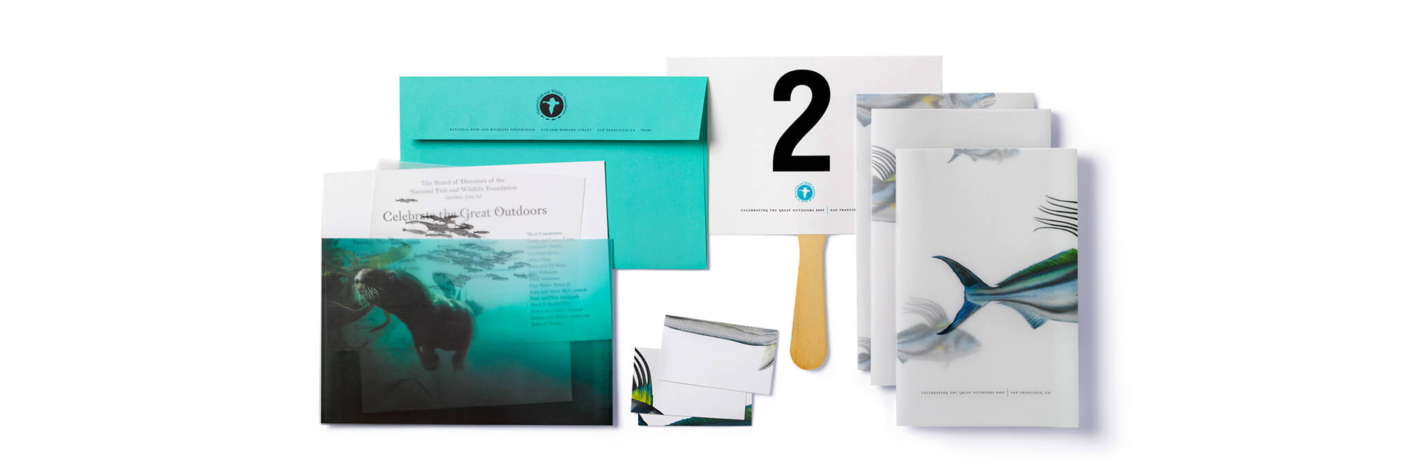 Sea creature themed program books, cards, invitation with teal envelope, and #2 paddle