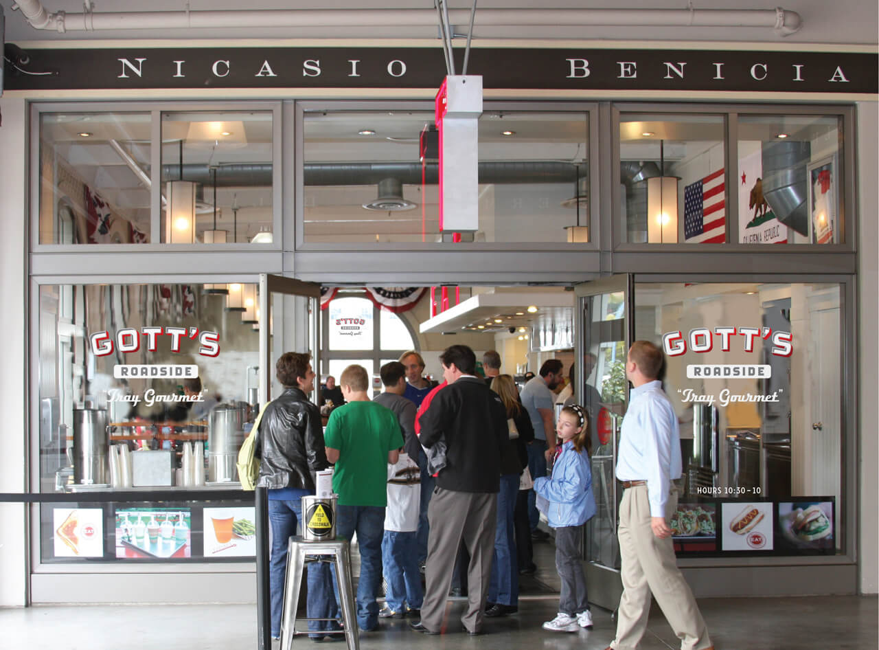 Crowd waiting in glass doorway of Gott's Roadside