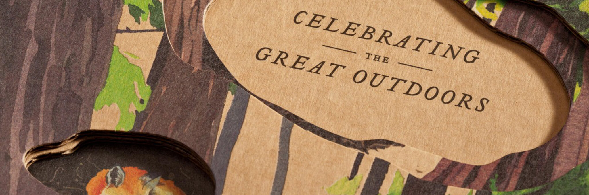 Close-up detail of "Celebrating the Great Outdoors" painted cardboard invitation