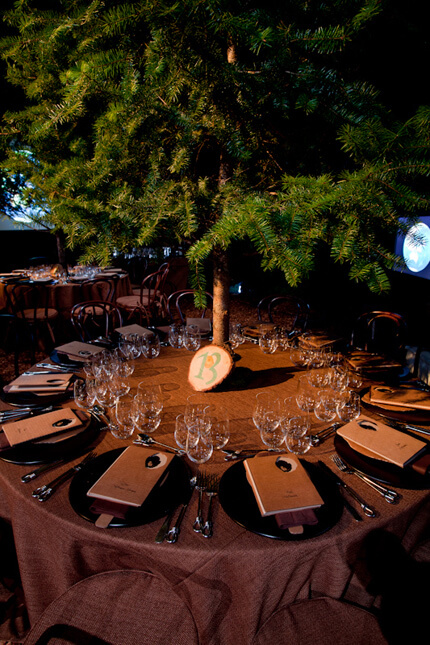 Table #13 with cardboard program books and pine tree centerpiece