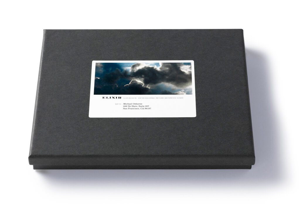 Dark gray box with stormy sky shipping label